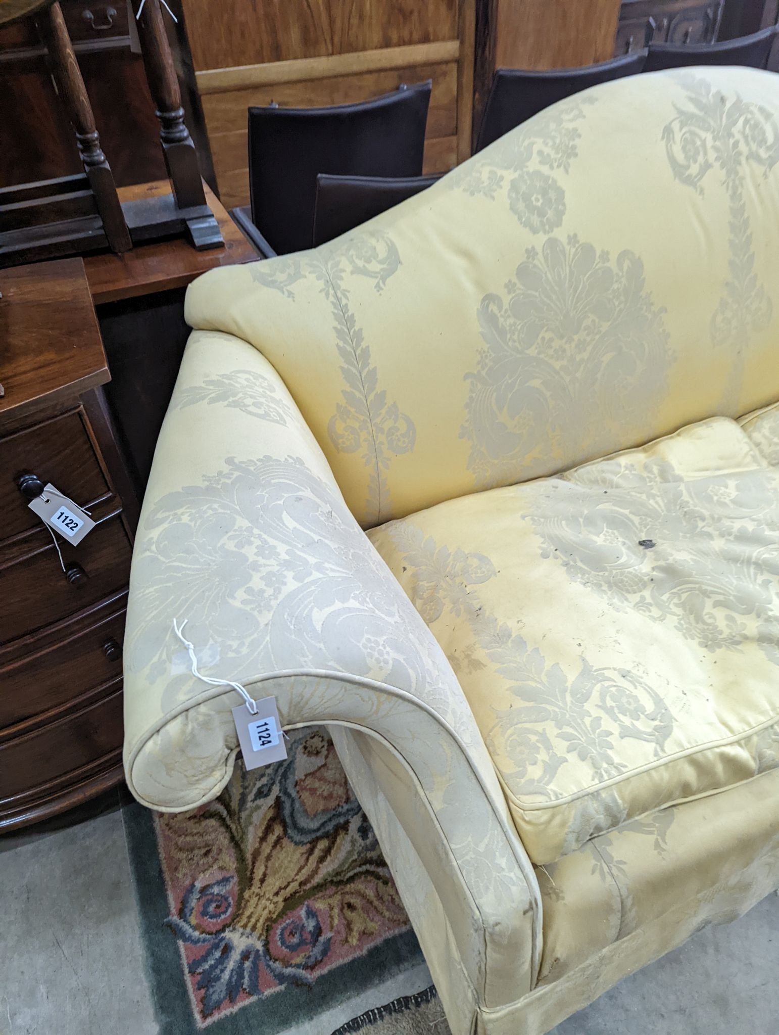 A George III style two seater upholstered scroll arm settee, length 200cm, depth 86cm, height 80cm